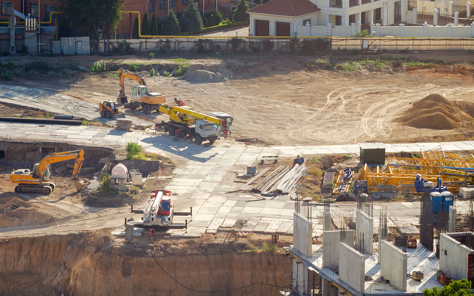 Aerial view of construction site, construction of new building in residential area